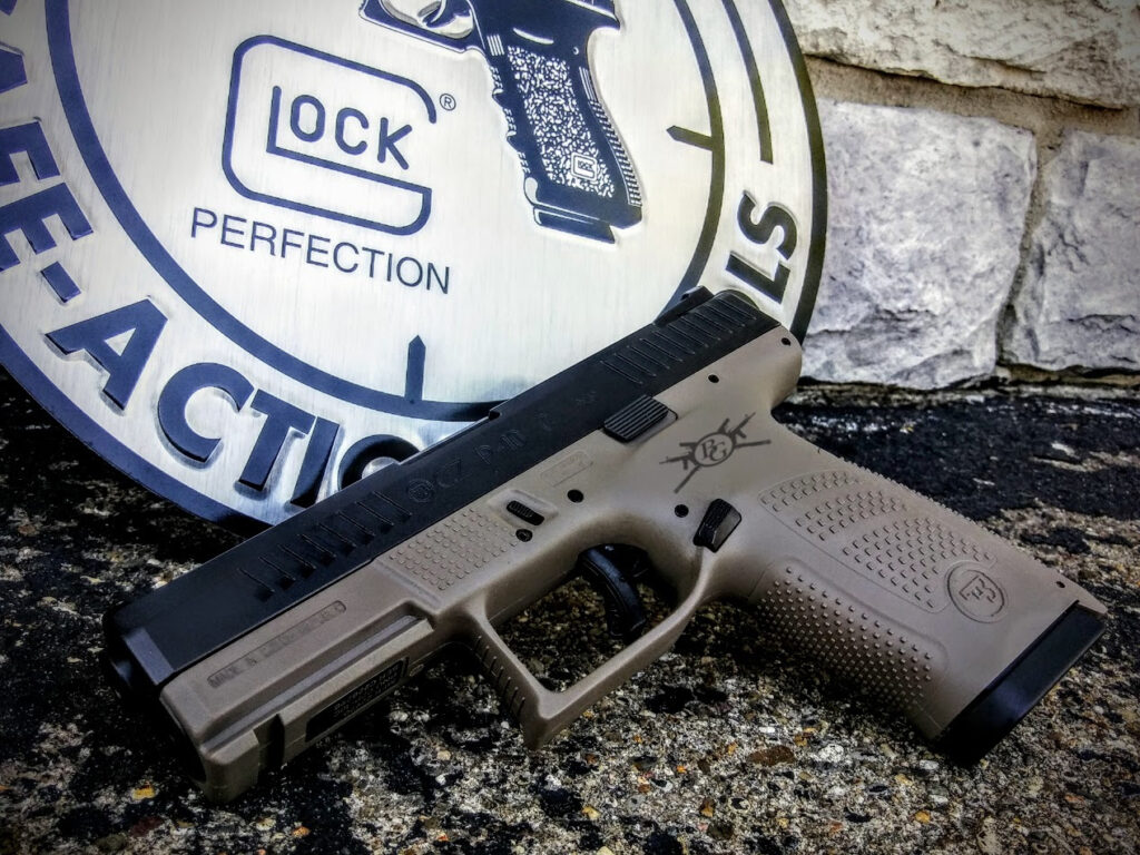 glock pistol with belcher's logo engraved on the grip