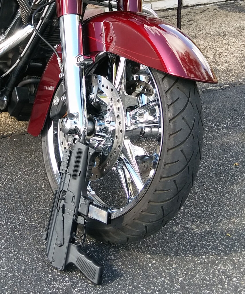 ak9 pistol with motorcycle